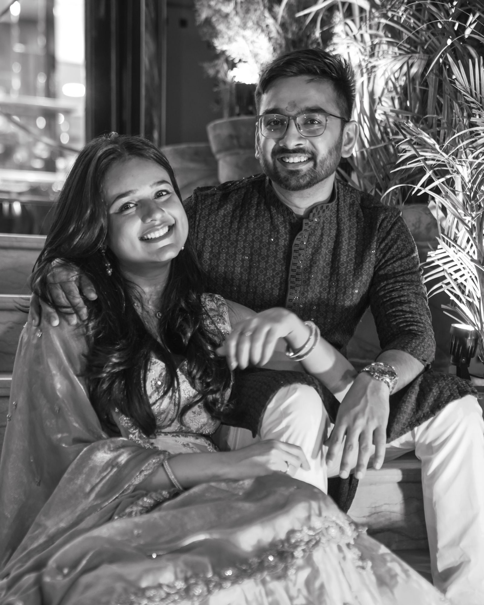 A couple laughing together, in black and white