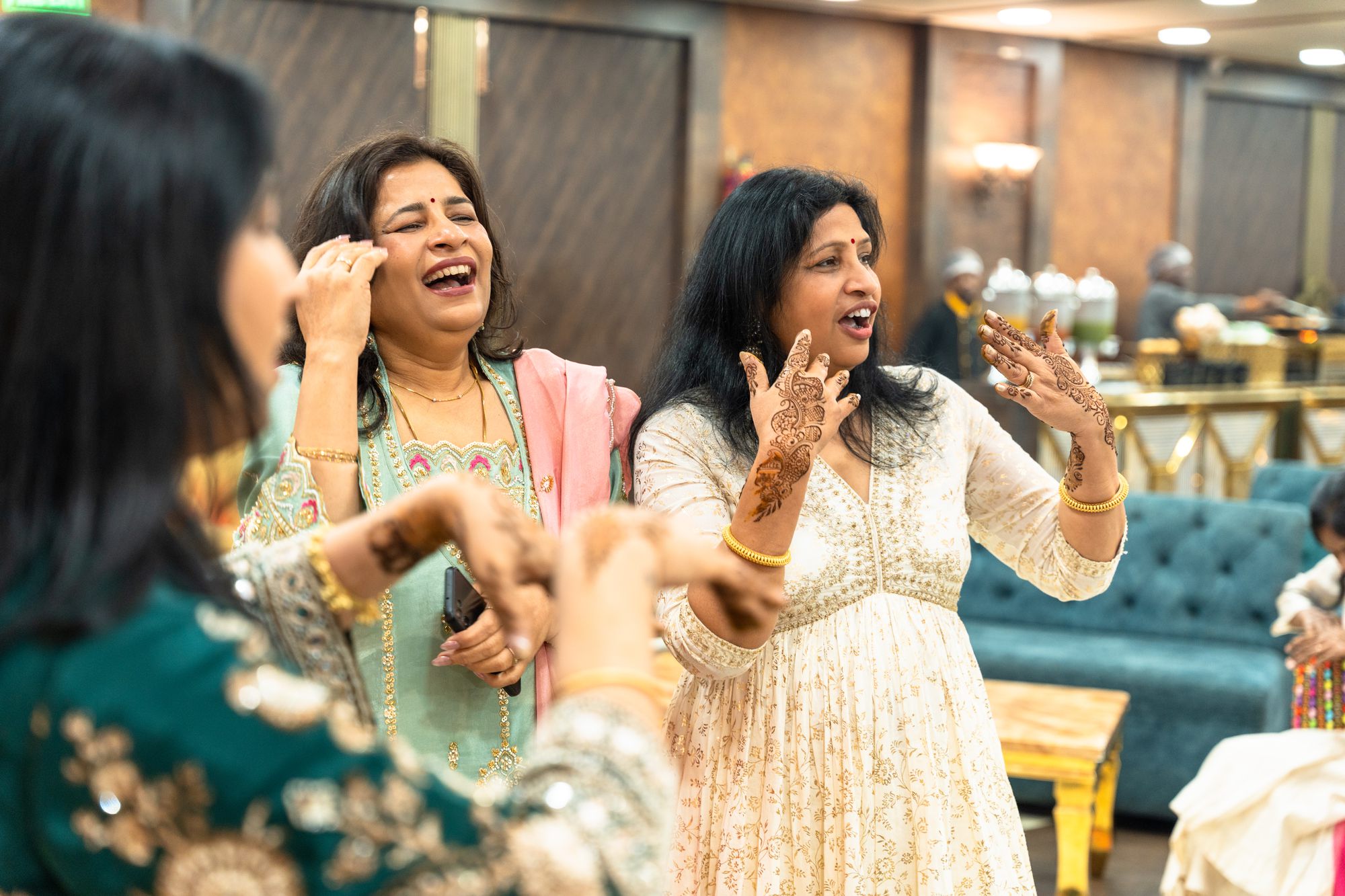 Guests laughing together at a celebration