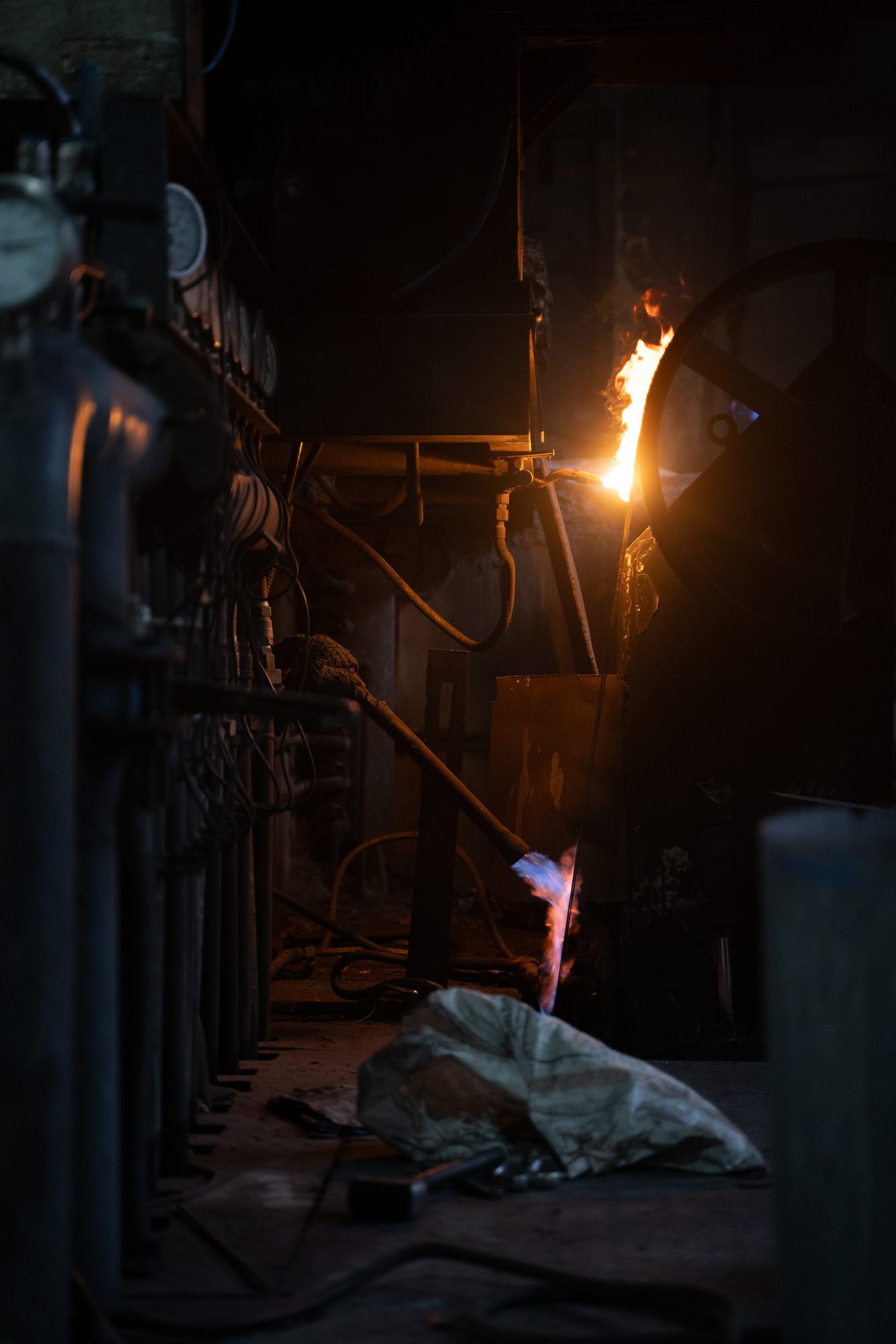 A worker pouring molten metal