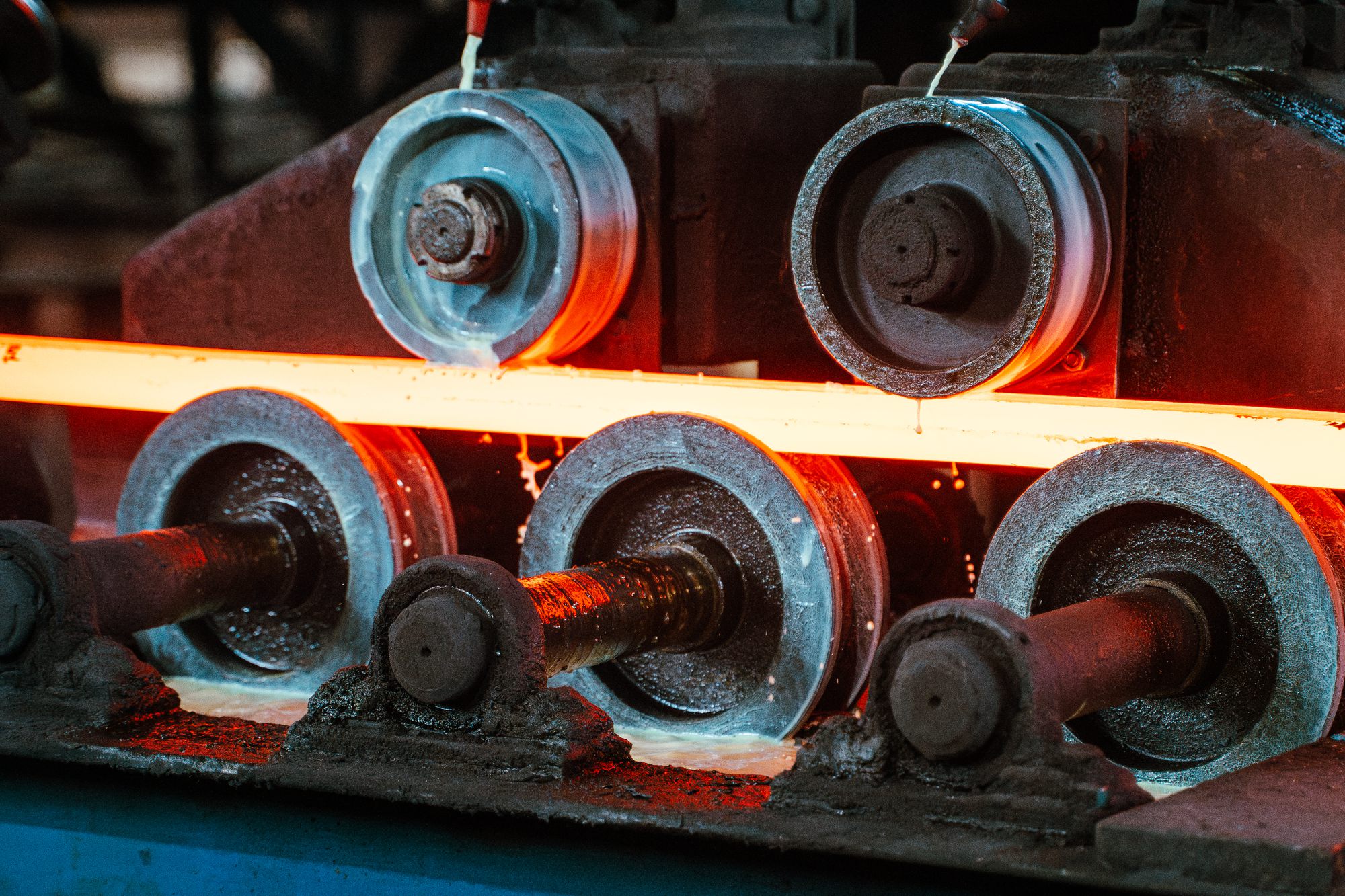 Copper bar passing through the rollers of a mill