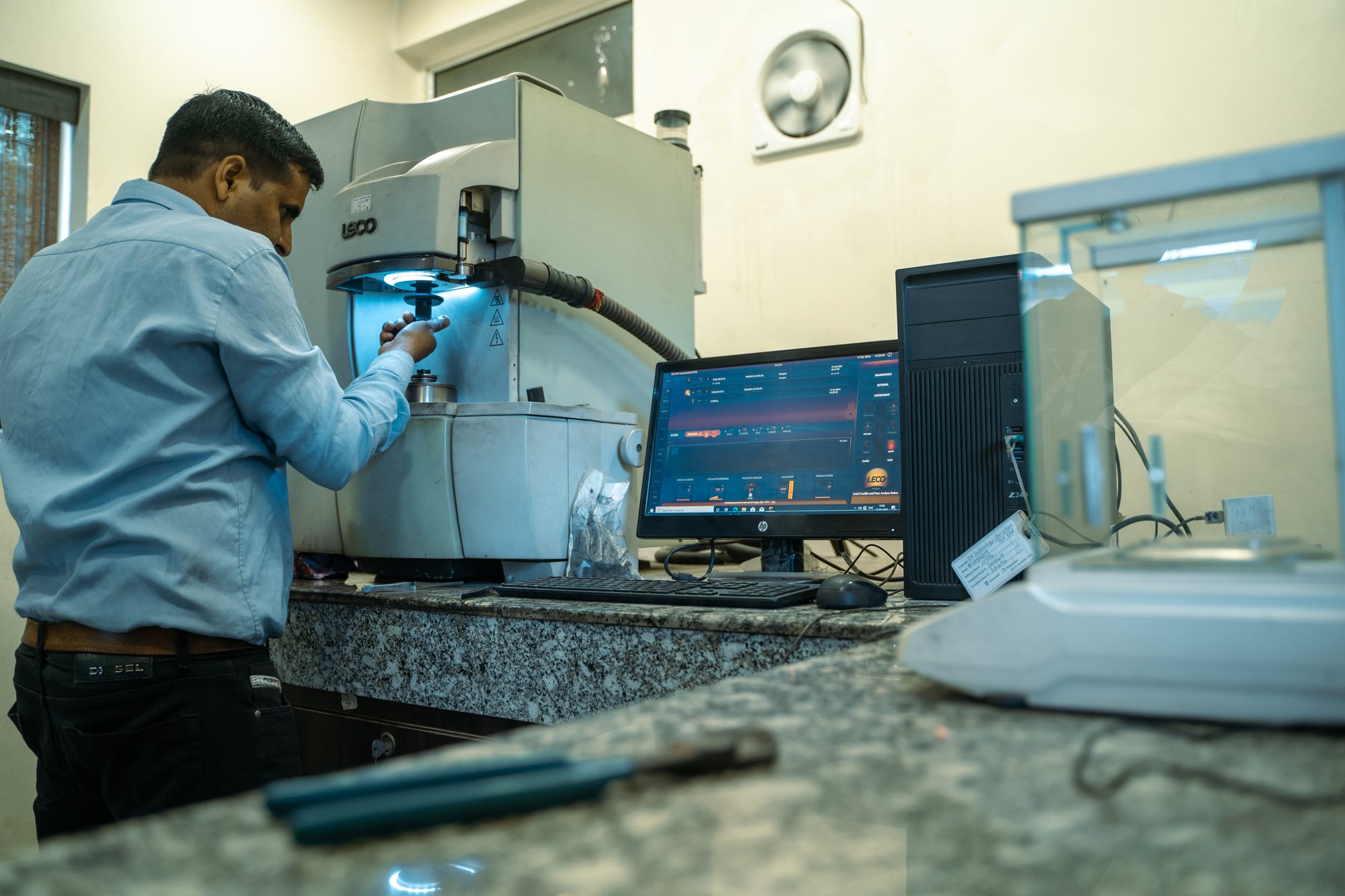 A technician testing samples in the plant laboratory